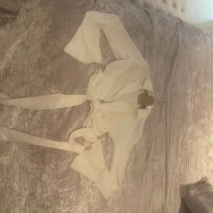 White long sleeve flare wrap tie crop top from Meshki. Perfect for styling